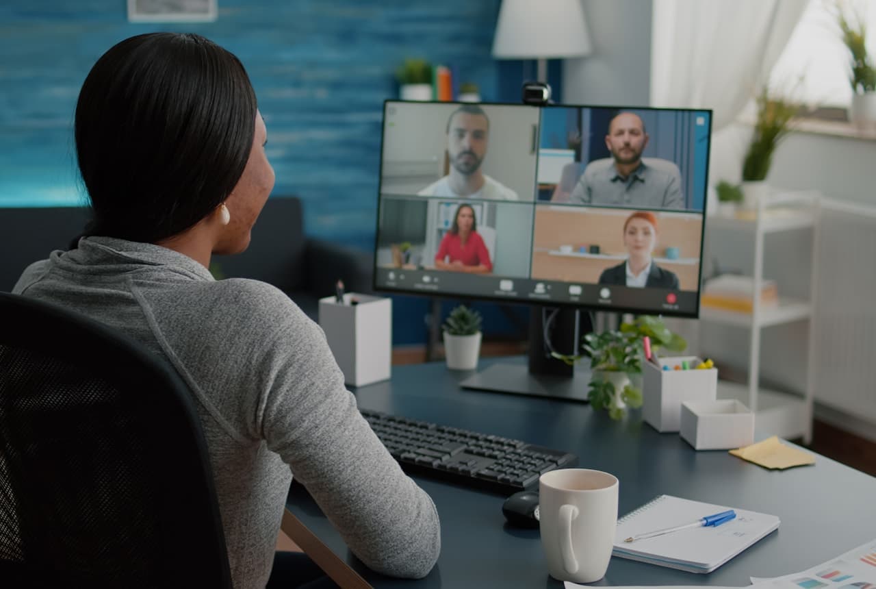 Reviewer working through a recorded panel session on screen